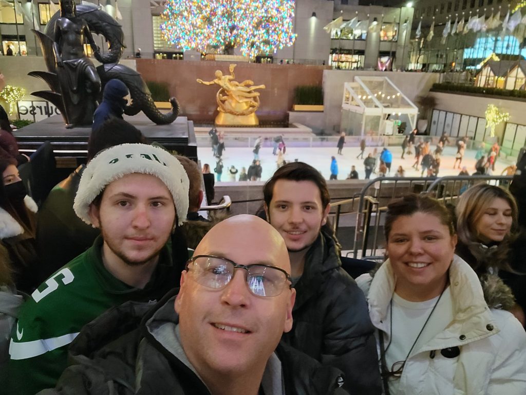 our family in front of the Rockefeller Center ice rink