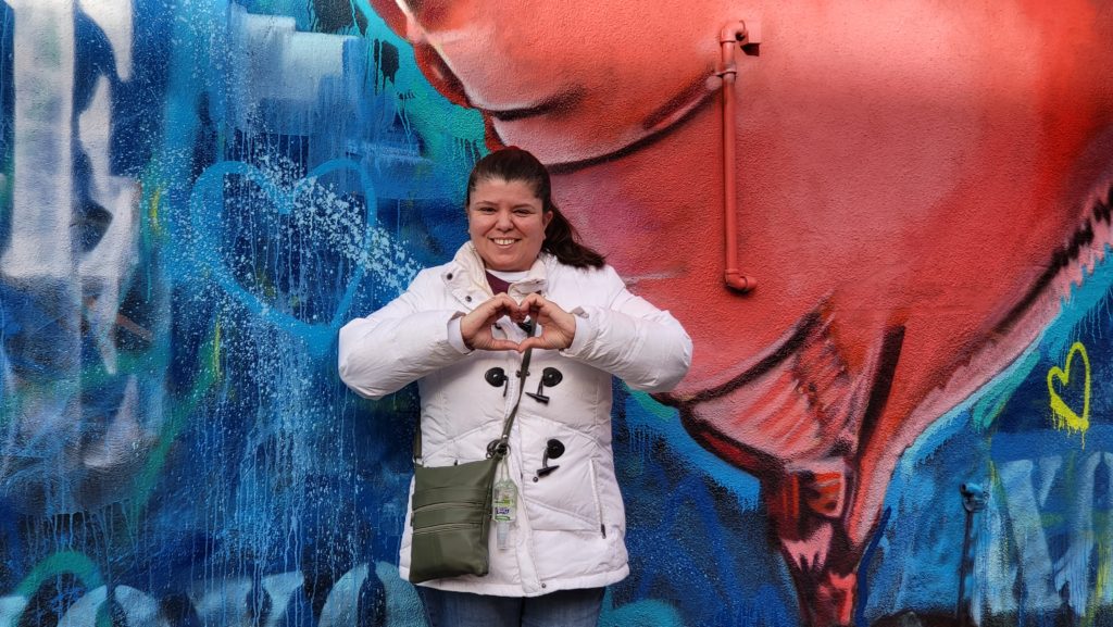 Me in front of a Brooklyn mural with a heart