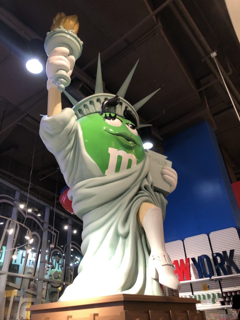 green M&M as statue of liberty